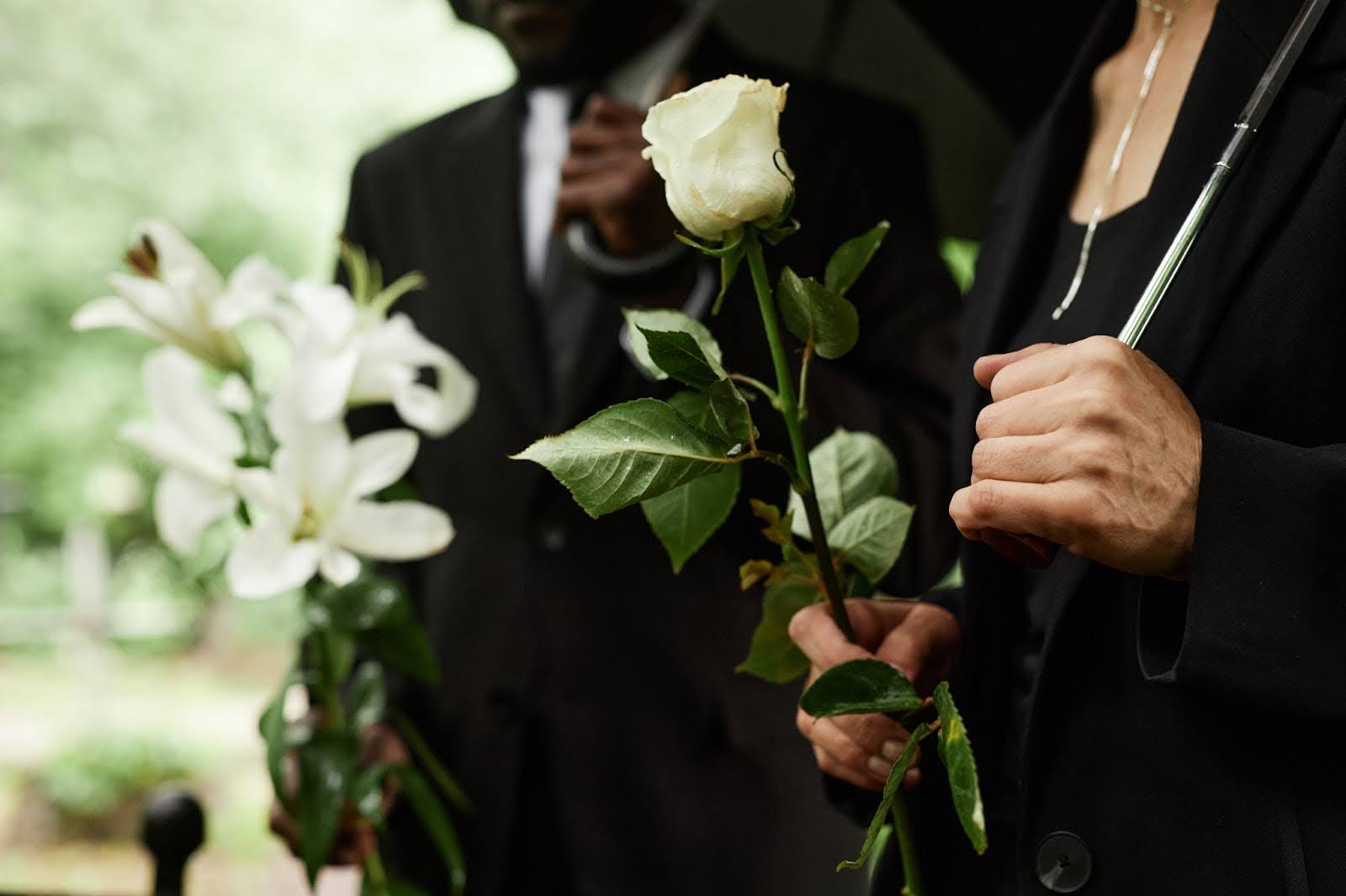 Family members grieving loss of loved one at funeral