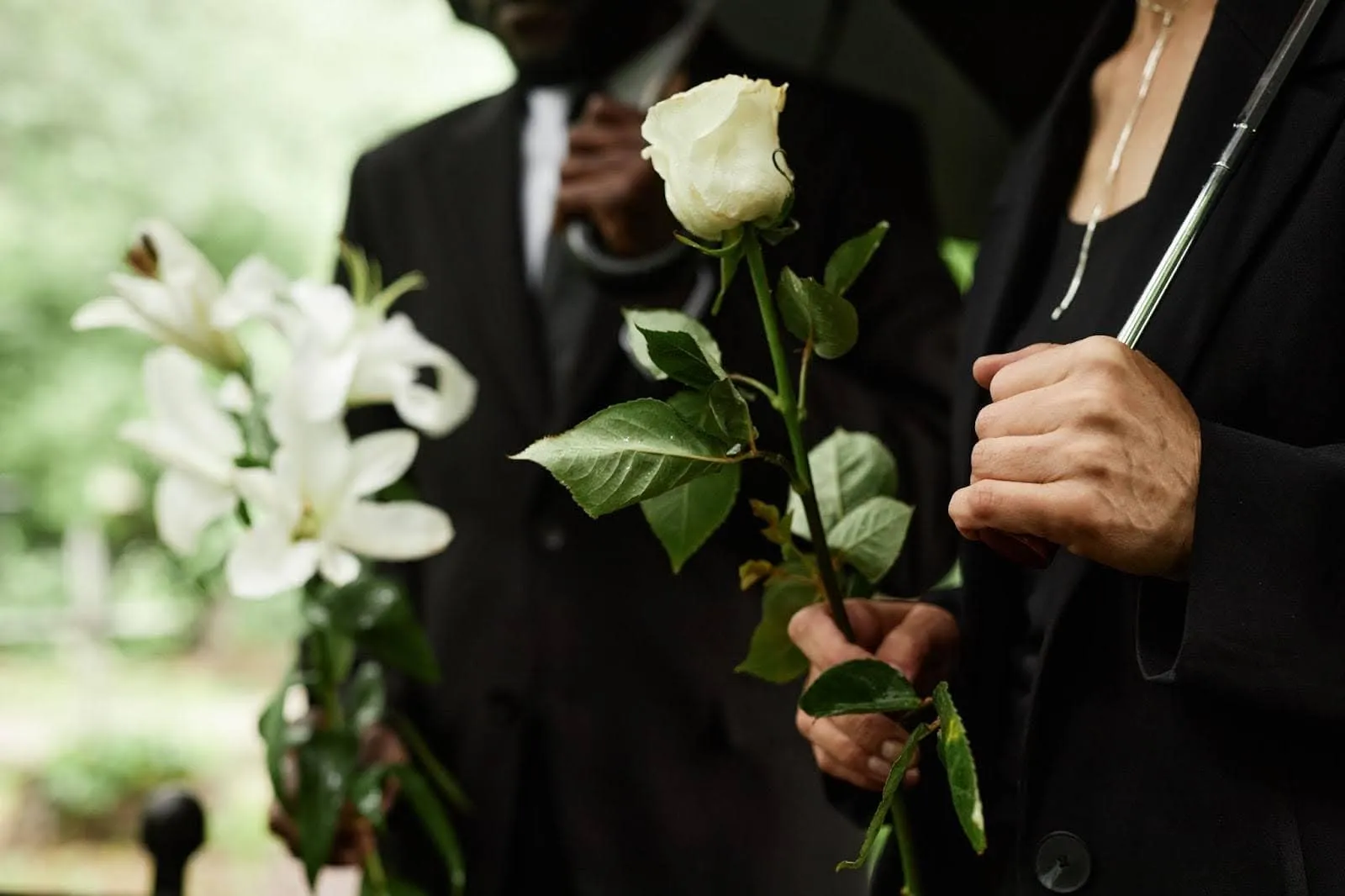 Family members grieving loss of loved one at funeral