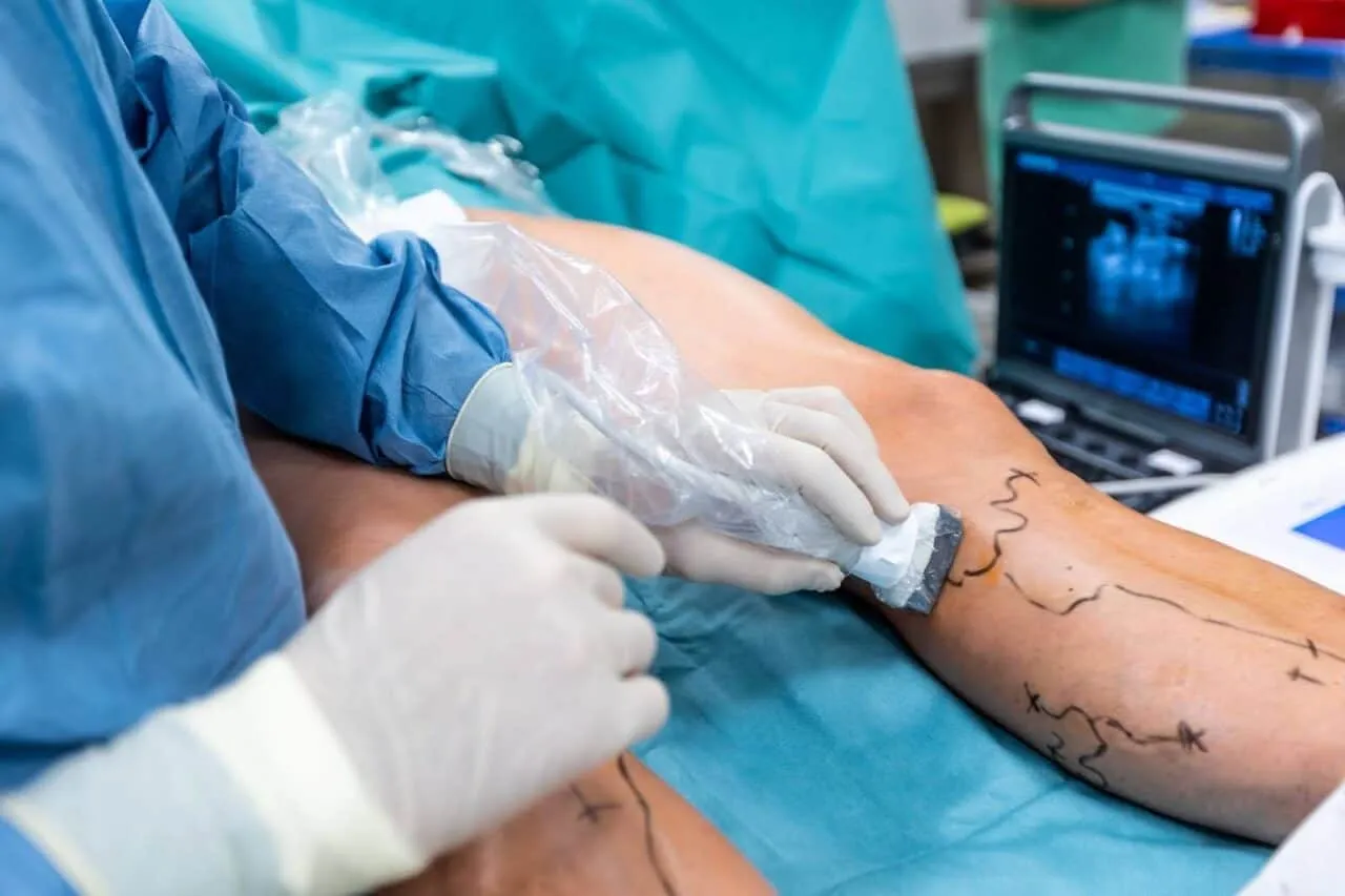 Doctor in operating room preparing patient for vascular surgery