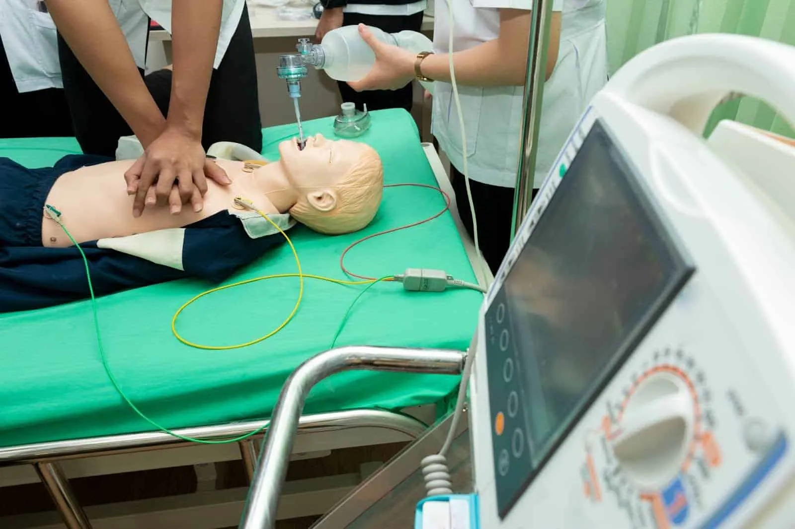 EMS personnel performing hands-on emergency medical training