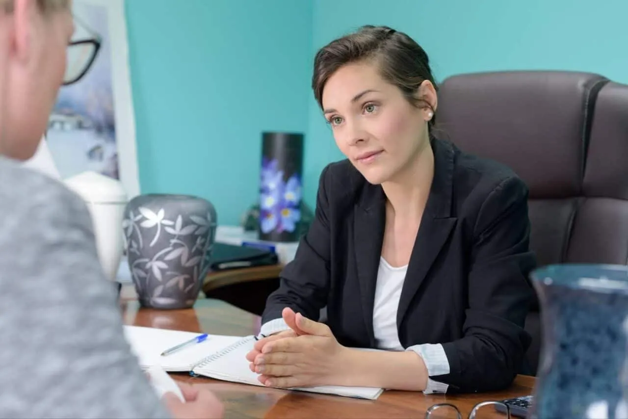 Family member of deceased loved one discussing direct cremation with funeral home